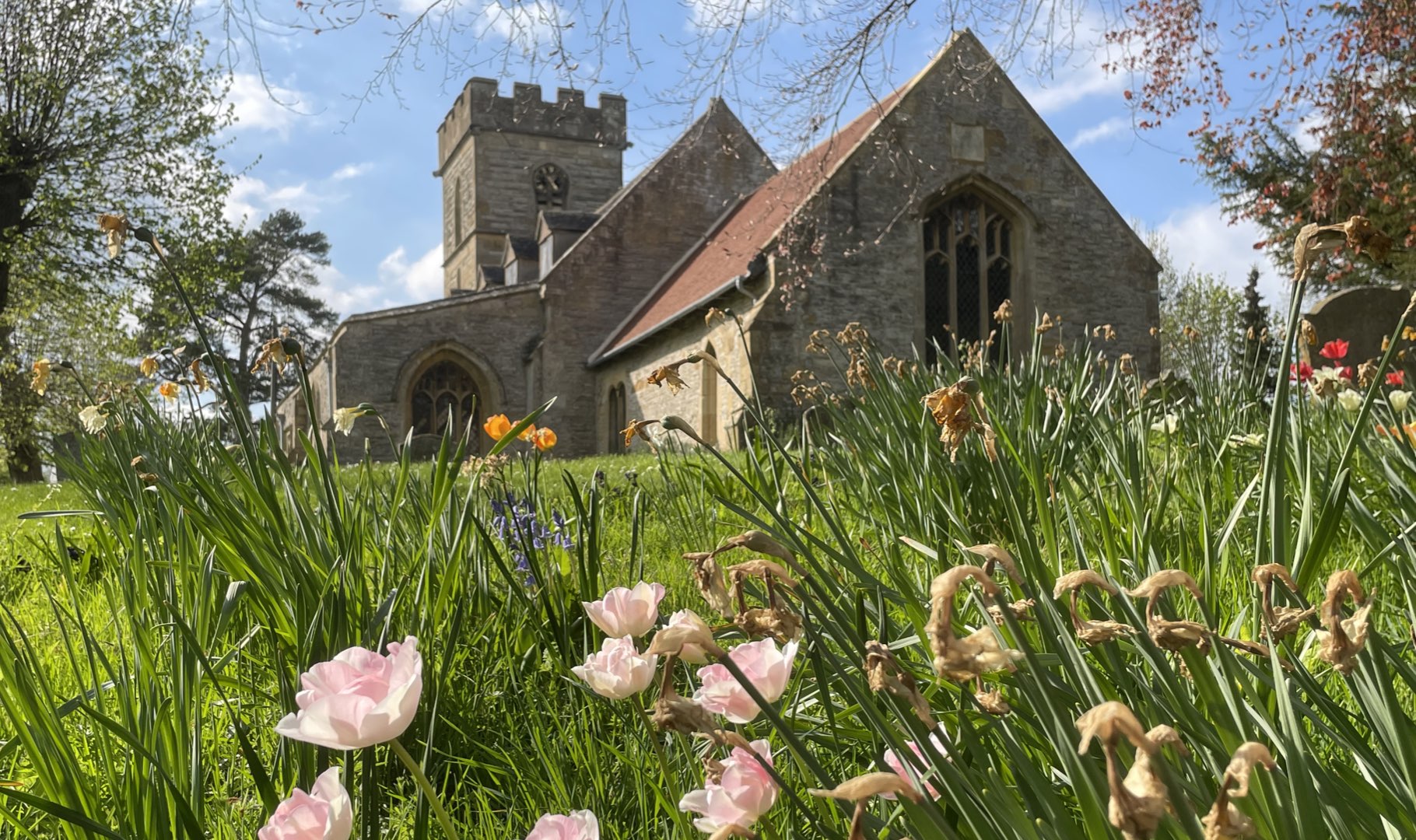 Pebworth Church with Spring flowers